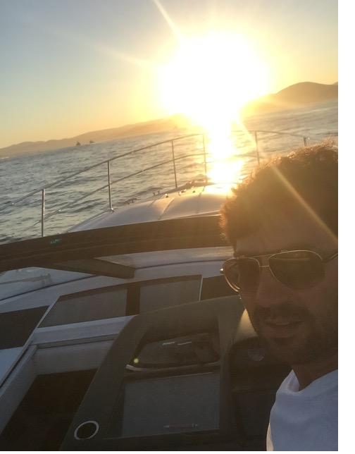 Sunset over the bay from the helm of a motor yacht in the South of France